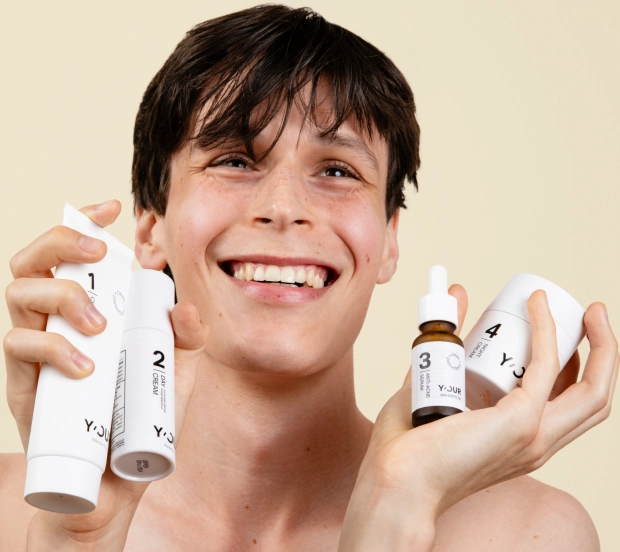 young men applying advanced moisturizing night cream to goodbye face fatigue and dryness