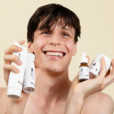 young men applying advanced moisturizing night cream to goodbye face fatigue and dryness